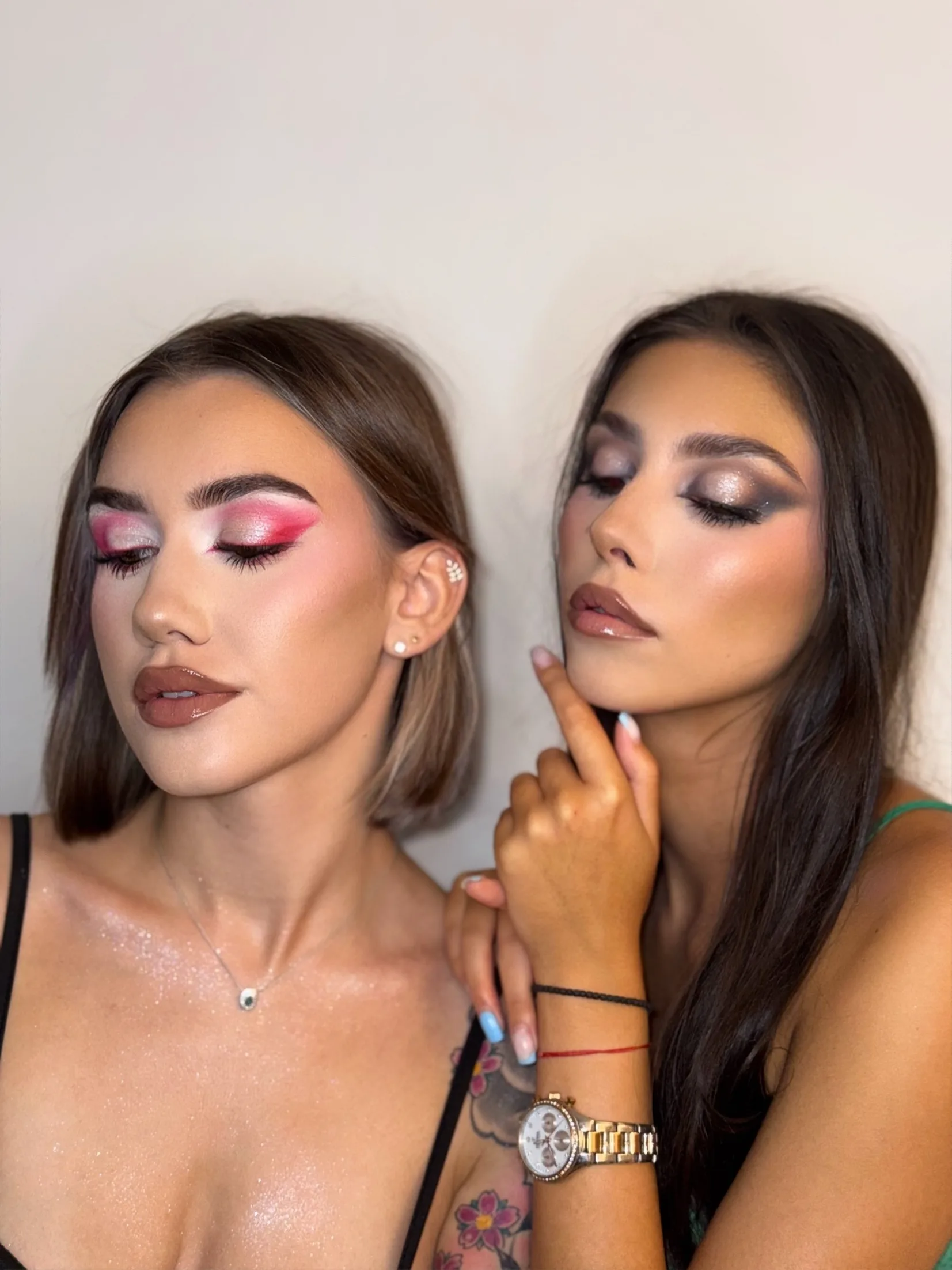 Two looks side by side — a fuchsia graphic lid with glossy chocolate lip on a blunt bob, next to a warm smoked bronze eye with a nude lip.